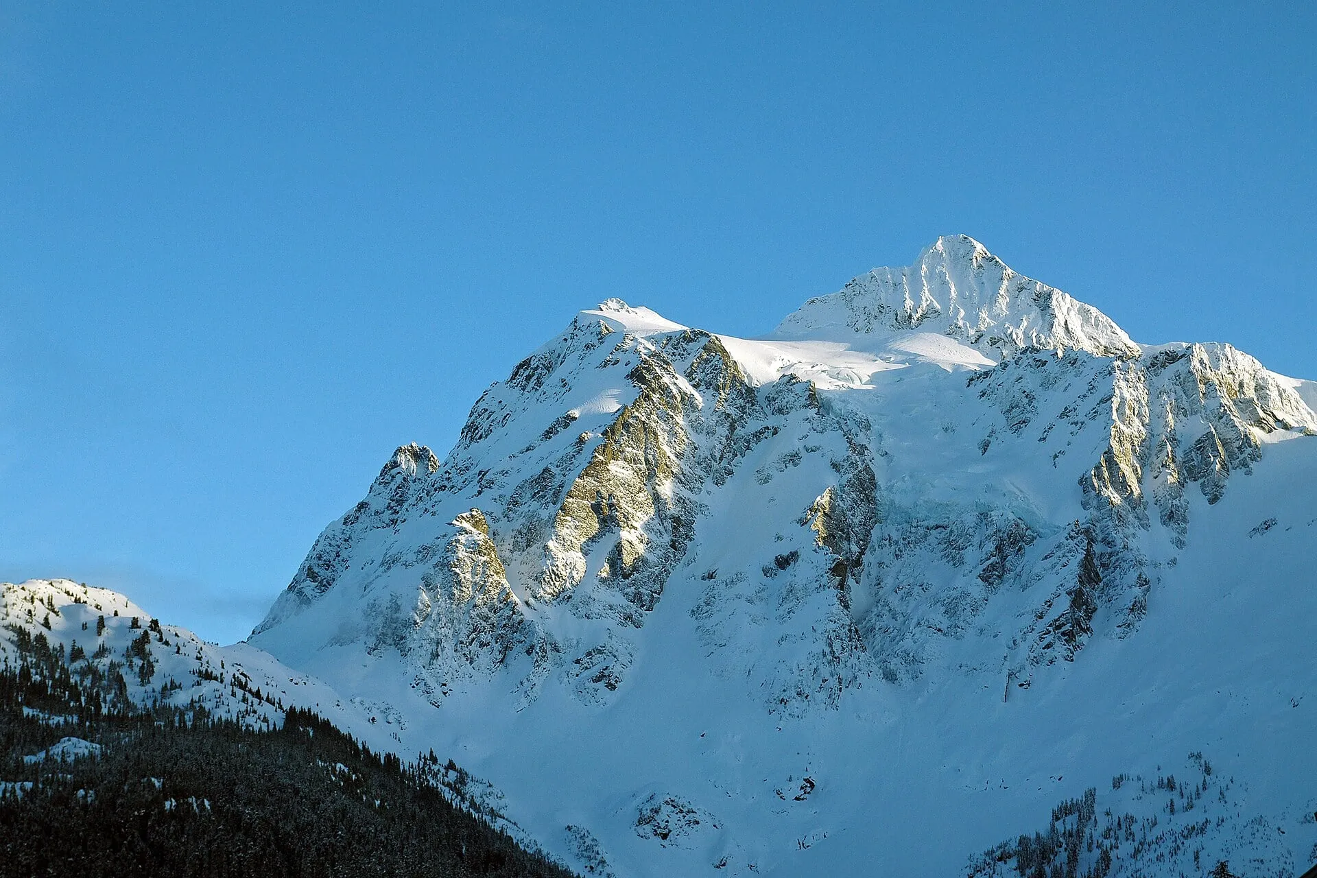Mount Shuksan under deep midwinter snow seen from Mt. Baker Ski Area