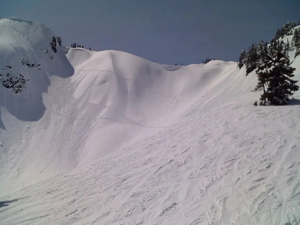 Deep late-season snow rounding the terrain at the 5,089-foot top of Chair 8 at Mt. Baker Ski Area